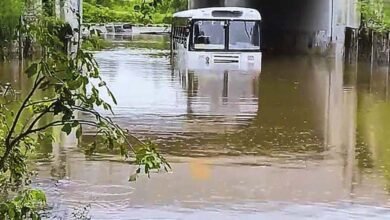 Locals Heroically Rescue Schoolchildren from RTC Bus Stuck in Floodwaters near Shamshabad